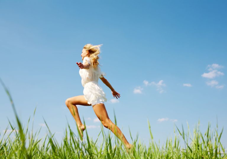 woman running in grass